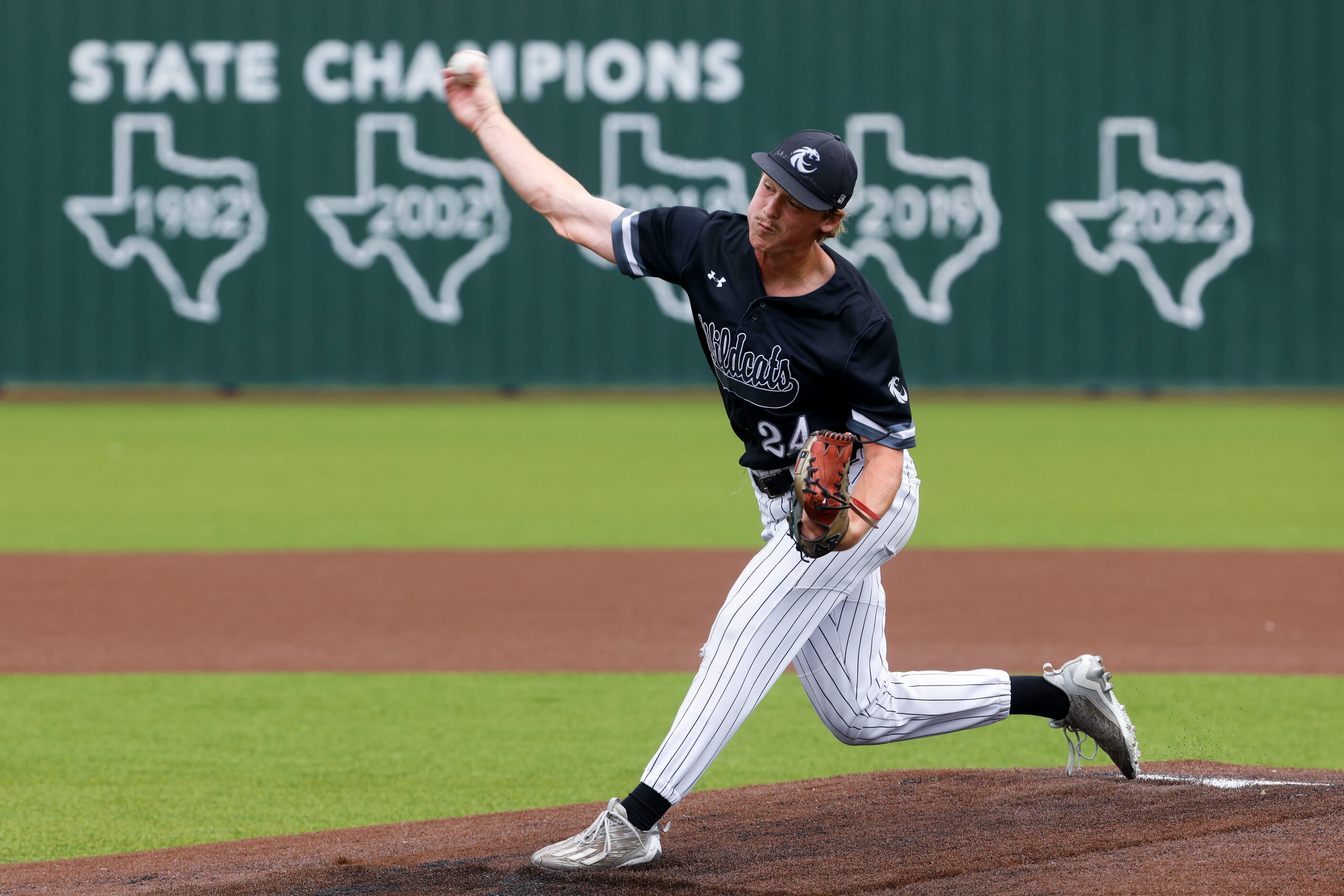 Denton Guyer’s Brad Pruett throws a pitch during the first inning of a baseball game against...