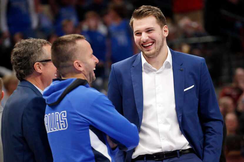 Dallas Mavericks forward Luka Doncic (right) laughs along with Dallas Mavericks guard J.J....