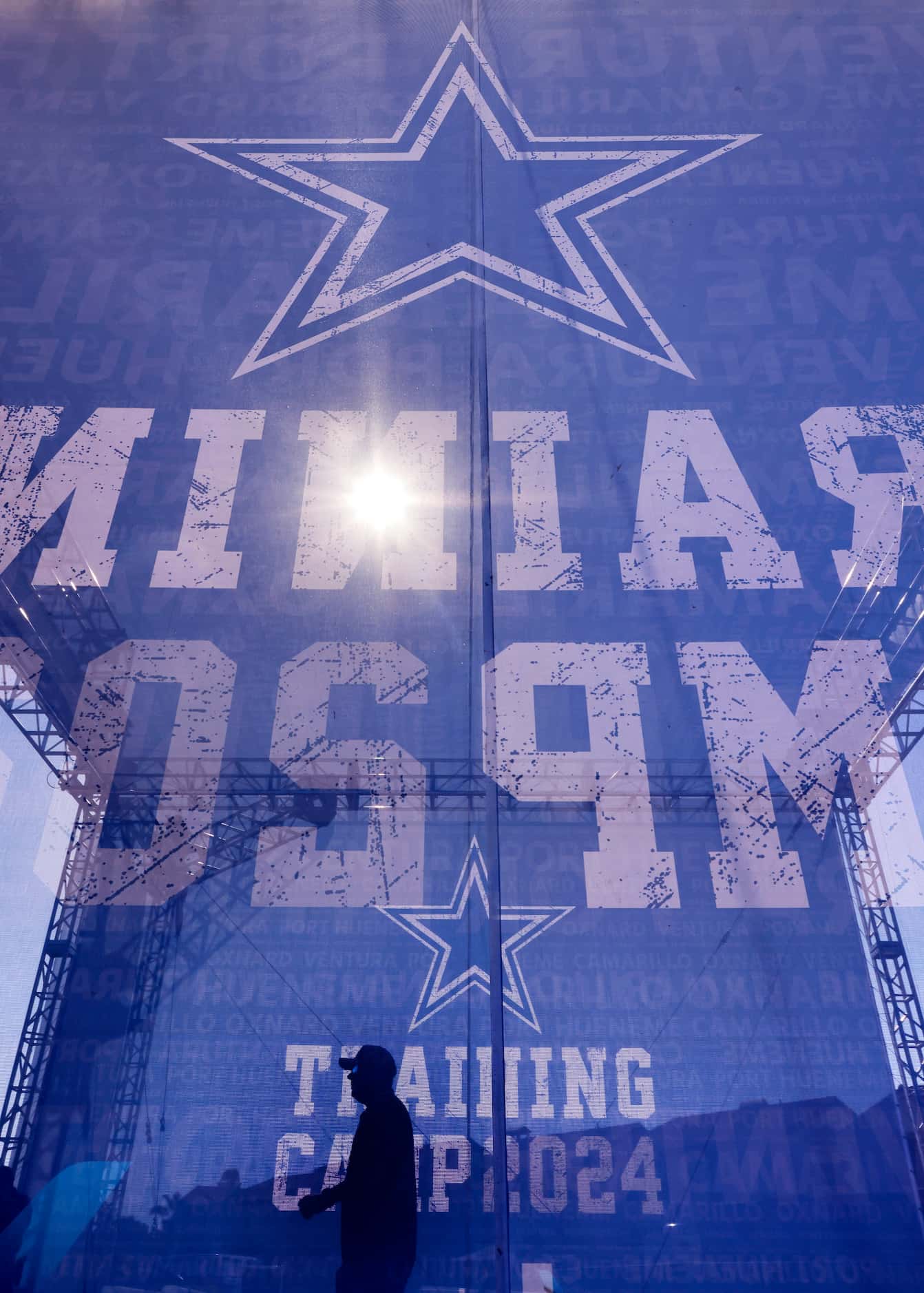 Fans pass through a 2024 Dallas Cowboys Training Camp corridor leading to the annual opening...