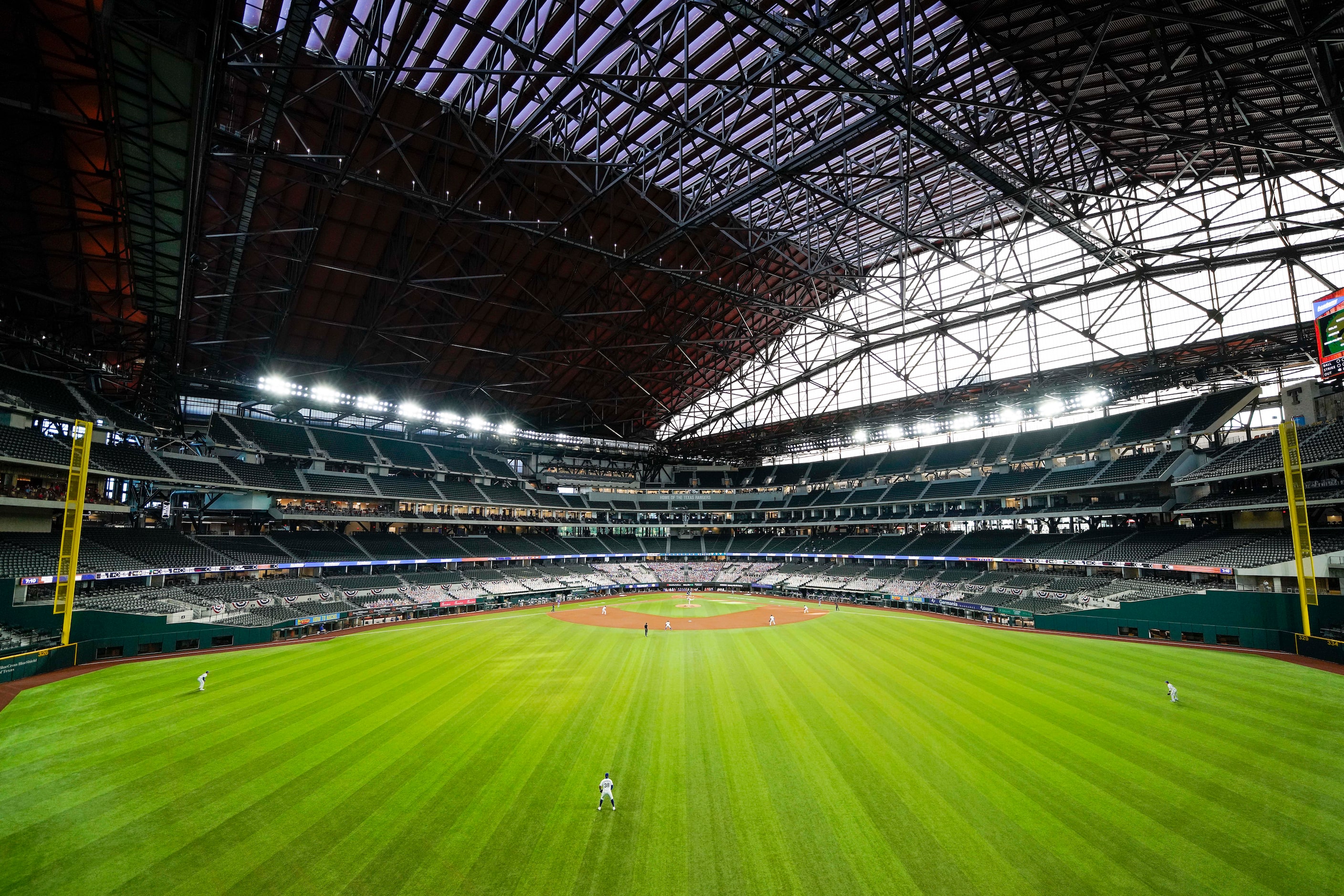 The Texas Rangers face the Colorado Rockies in the first inning on opening day at Globe Life...