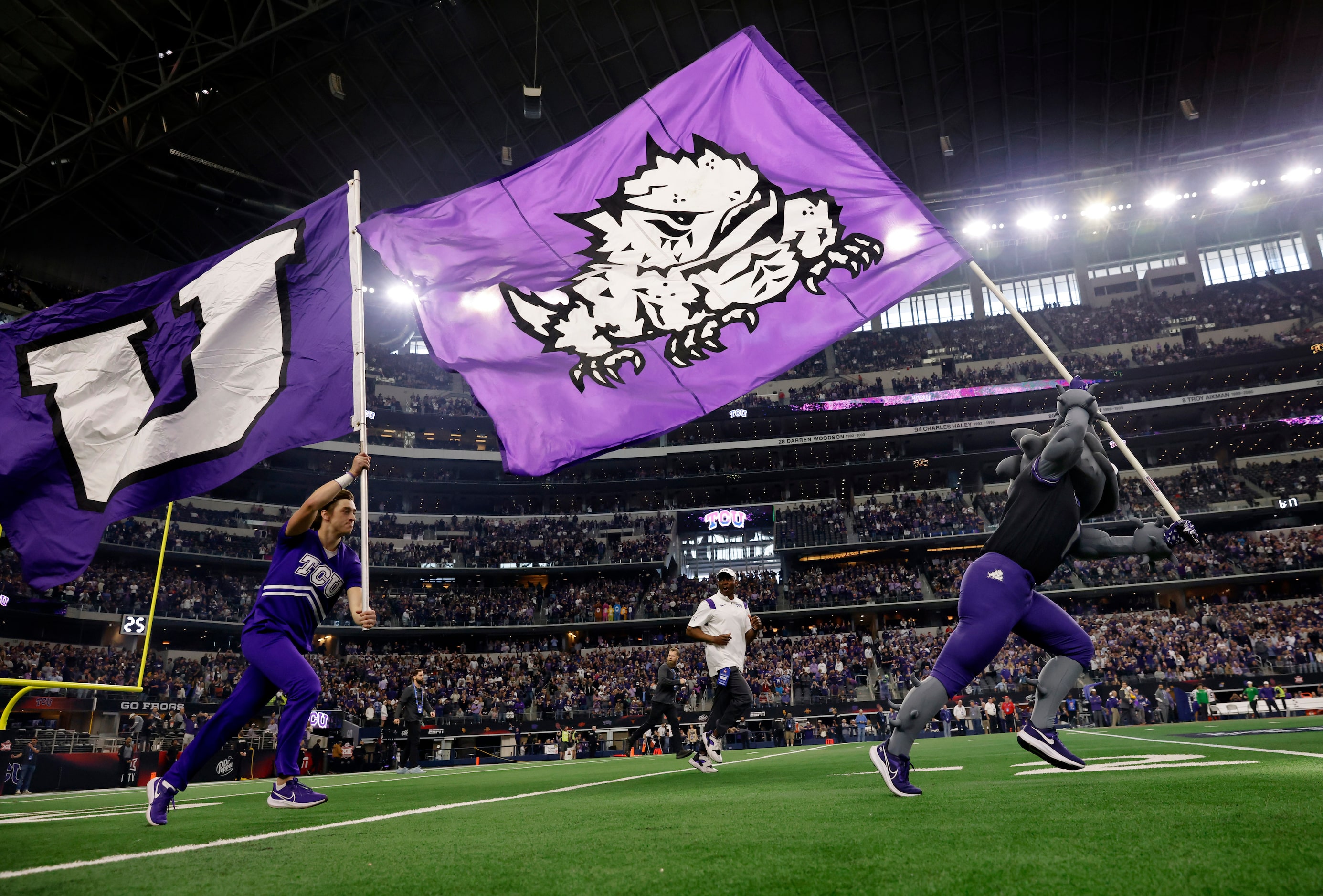 The TCU Horned Frogs mascot carries the school flag as the team is introduced before the Big...