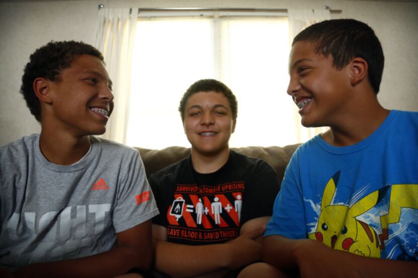 The Ash brothers -- (from left) Marcus, Terrence and Curtis -- got braces through Medicaid...