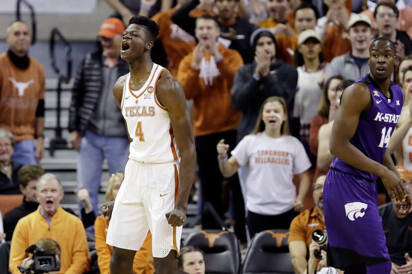 Texas forward Mohamed Bamba (4) reacts after he scored against Kansas State forward Makol...