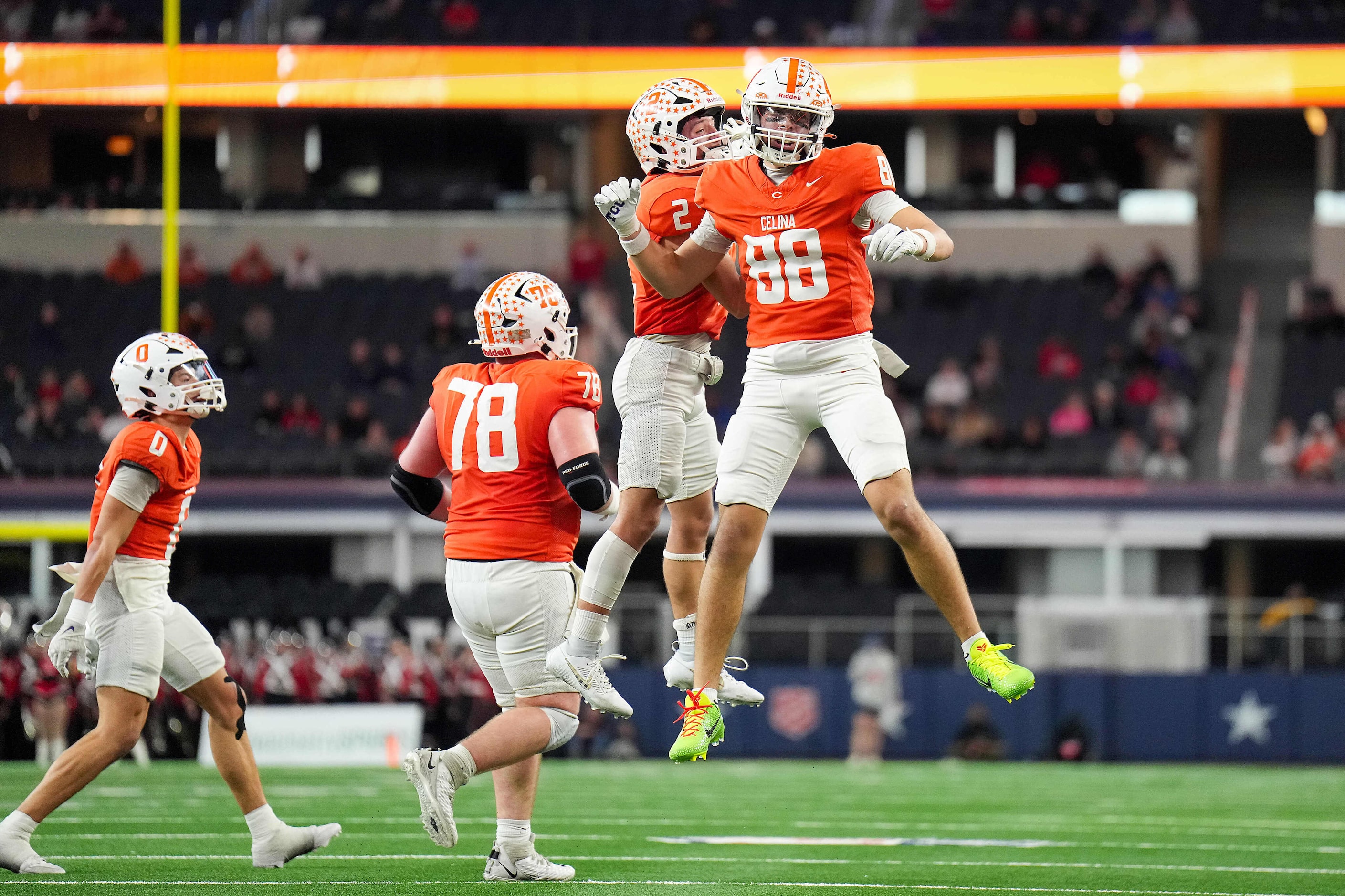 Celina's Wyatt Villarreal (88) celebrates with Colton Rodriguez (2), center Ty Hughes (78)...