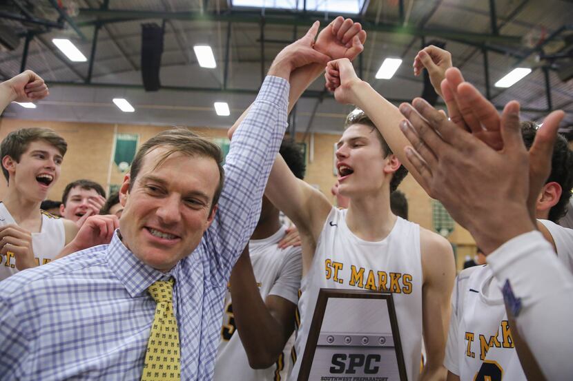 St. Mark's coach Greg Guiler (left) celebrates with his team after winning a SPC boys...