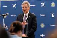 Federal Aviation Administration chief Mike Whitaker speaks at a news conference at FAA...