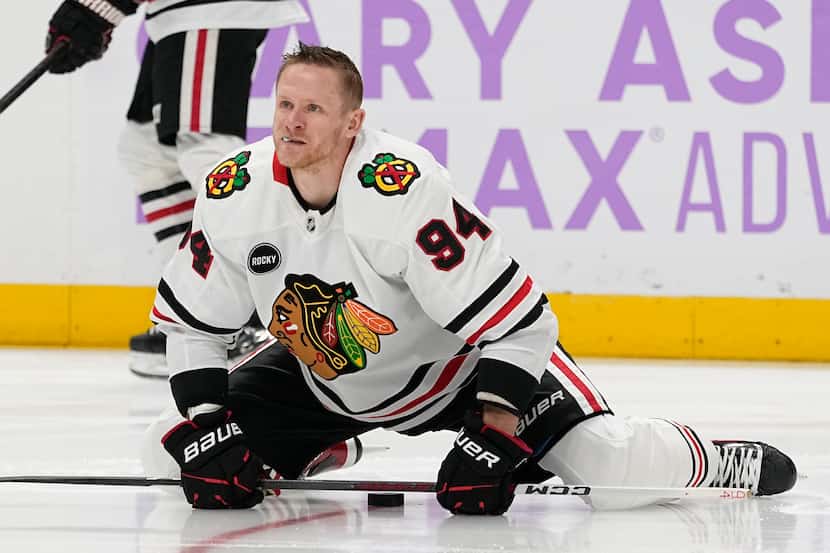 Chicago Blackhawks right wing Corey Perry (94) warms up before an NHL hockey game against...