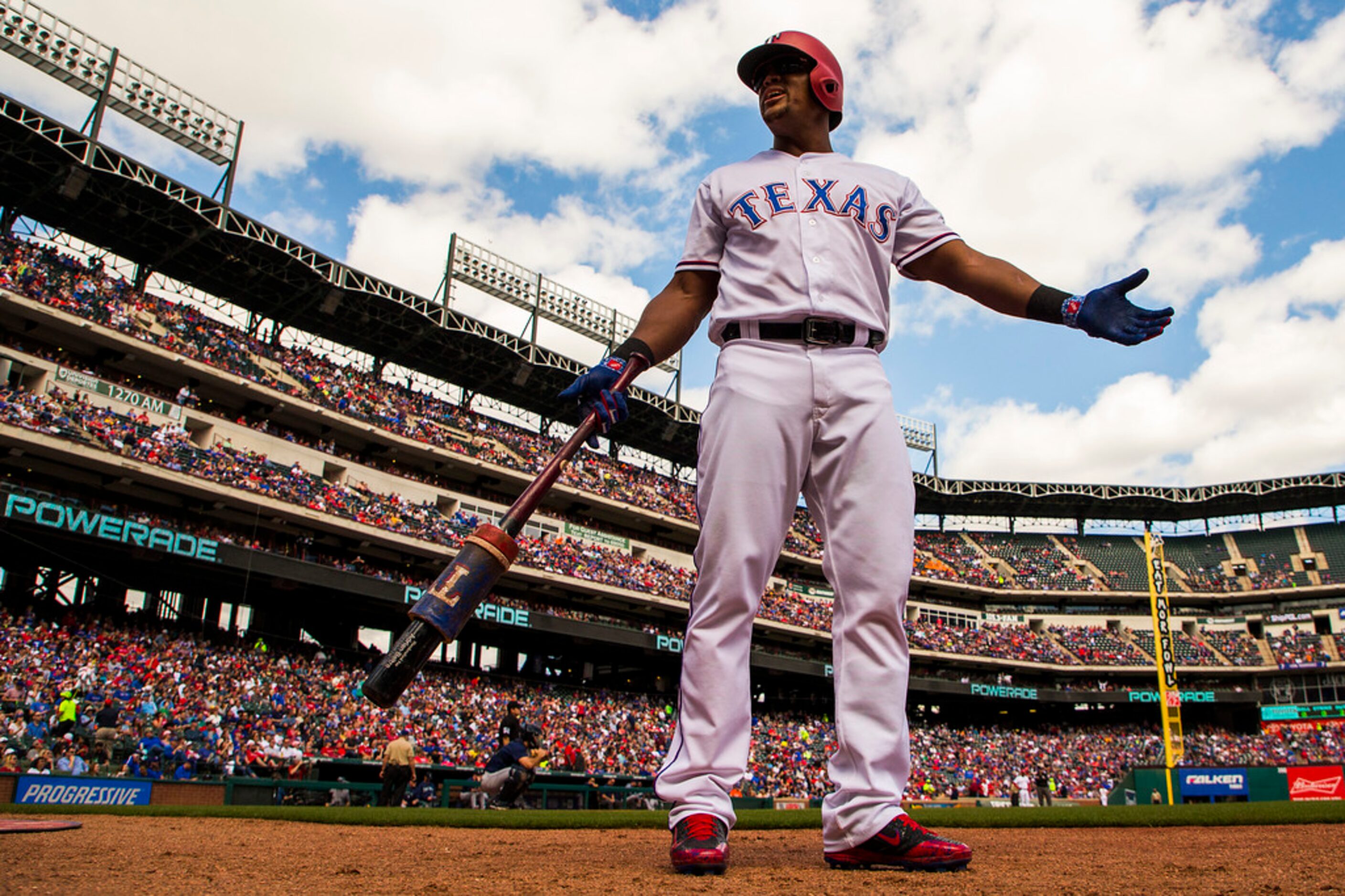 Texas Rangers third baseman Adrian Beltre motions to the crowd from the on deck circle...