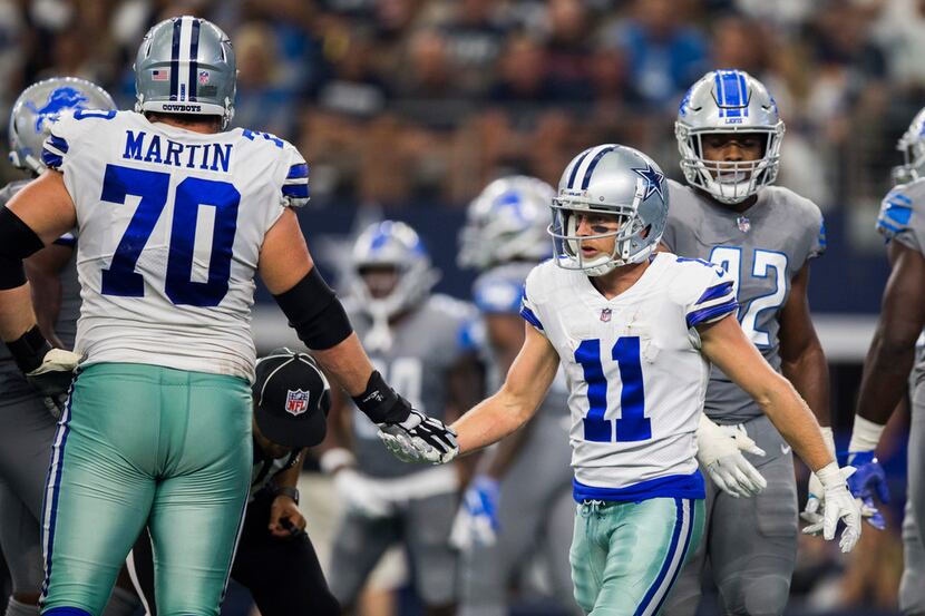 Dallas Cowboys wide receiver Cole Beasley (11) celebrates a catch with offensive guard Zack...