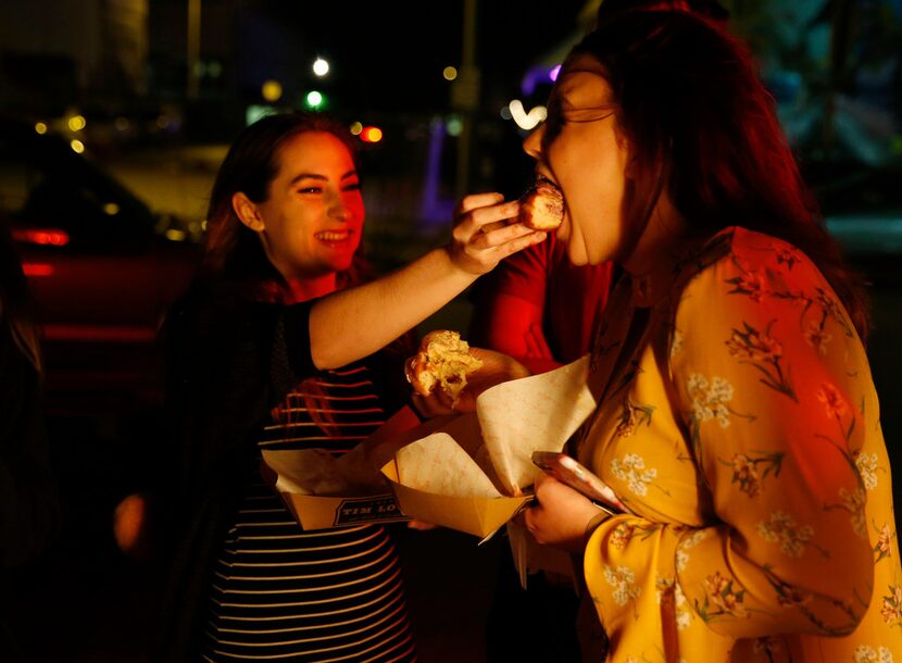 Kaye Kinser of Denton lets Kenna Harding of Denton taste her doughnut.