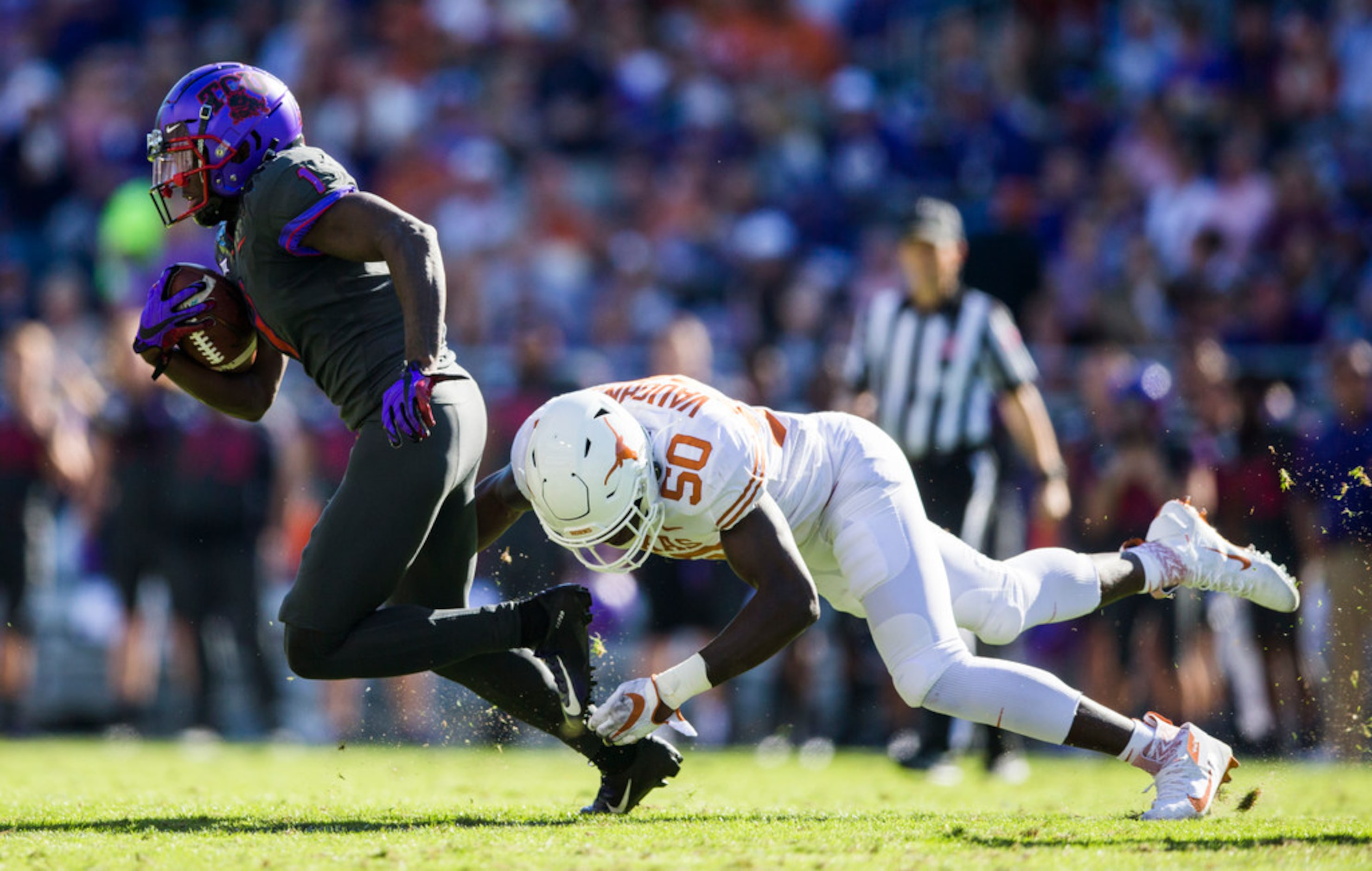 TCU Horned Frogs wide receiver Jalen Reagor (1) escapes a tackle by Texas Longhorns...