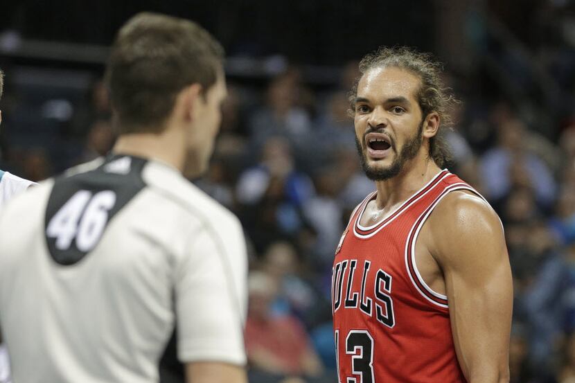 Chicago Bulls' Joakim Noah, right, argues a call with referee Ben Taylor, left, during the...