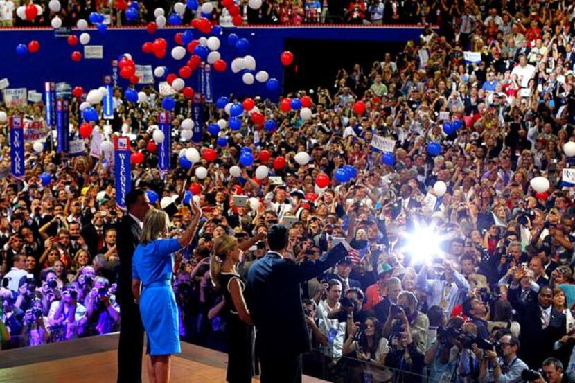 Presidential candidate Mitt Romney and his wife, Ann, (left) and Paul Ryan and his wife,...