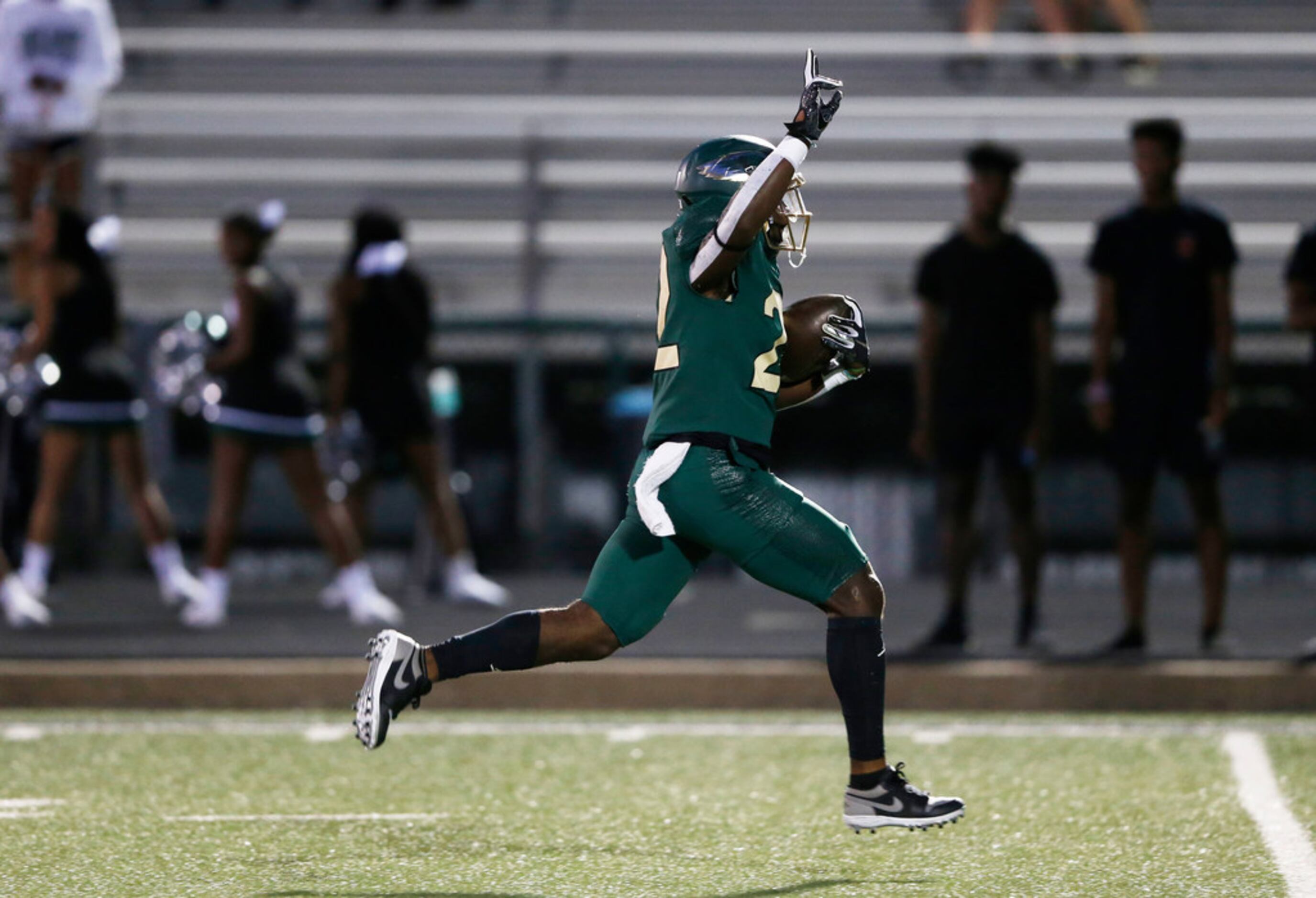DeSoto's Jyison Brown (22) breaks for a long rushing touchdown in a game against Mansfield...