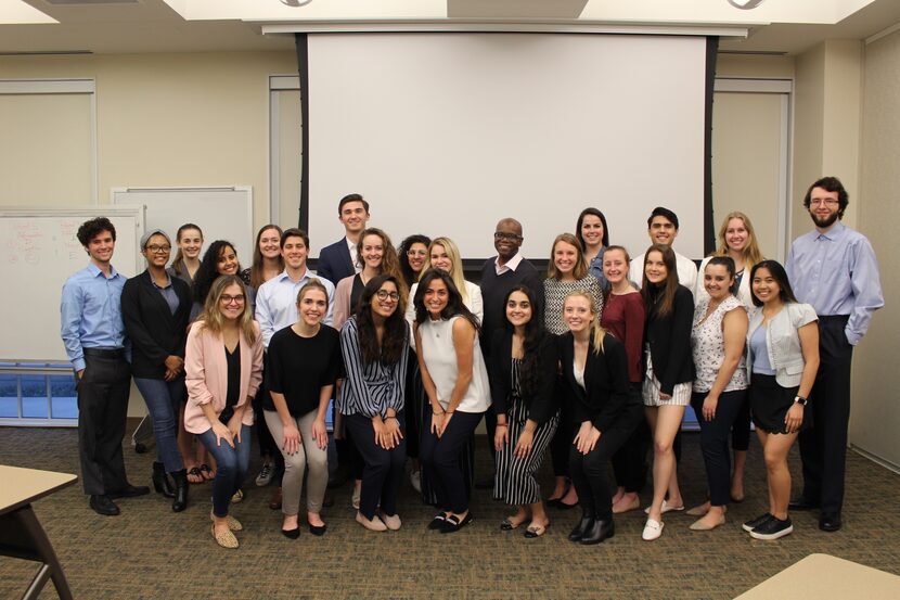 Dr. Eric Bing (back center) poses with the students in his 2020 “Creating Global and Public...