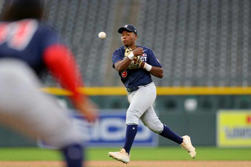 DENVER, CO - JULY 09:  Termarr Johnson #9 of the National League Team throws to first base...