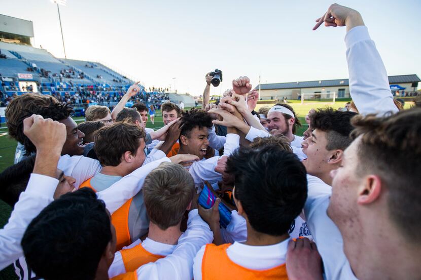 Flower Mound players rally around forward Joe Perryman (29) after a 3-2 win in a UIL...