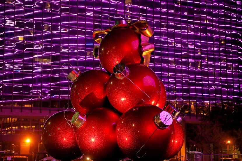 The Omni's big, red ornaments weigh 1,200 apiece. They're set into place with a crane. 