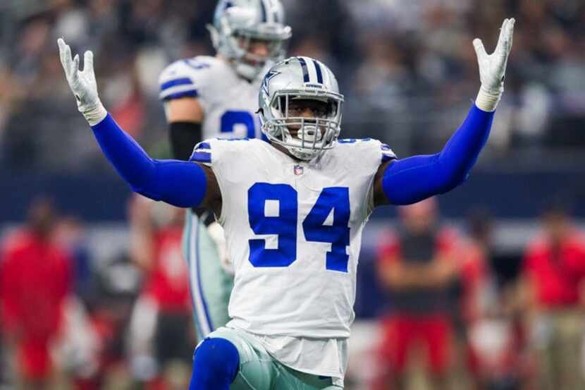 Dallas Cowboys defensive end Randy Gregory (94) tries to pump up the crowd during the third...