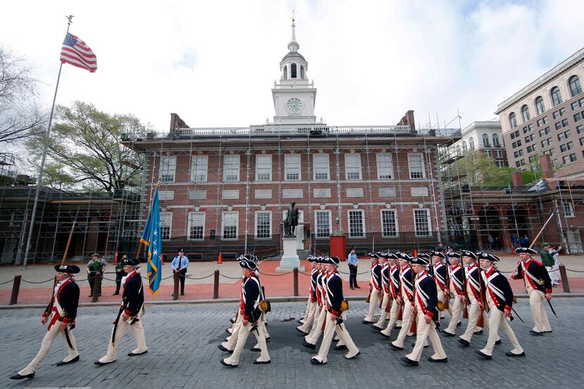 Members of the 3rd U.S. Infantry Regiment (The Old Guard) march past Independence Hall...
