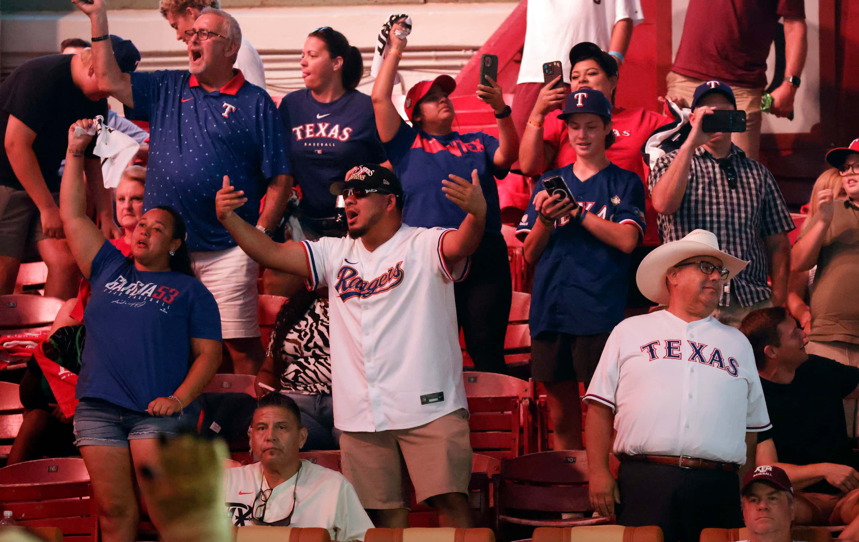 Texas Rangers fans stand and applaud as their 30th pick in the MLB Draft is about to be made...