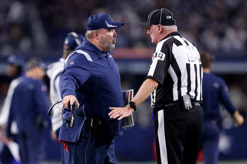 Dallas Cowboys head coach Mike McCarthy argues that a late hit call should have been called...