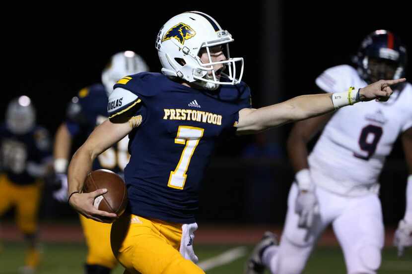 Prestonwood Christian quarterback Ryan Cash (7) attempts to make a play in the first half...