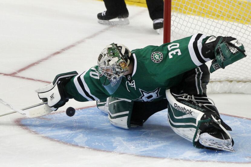 Dallas Stars right wing Valeri Nichushkin (43) goes flying as he scores on Colorado...