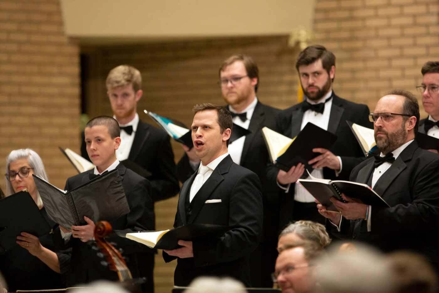 Tenor Dann Coakwell (center) is the Evangelist, with David Grogan (right) as Jesus, in the...