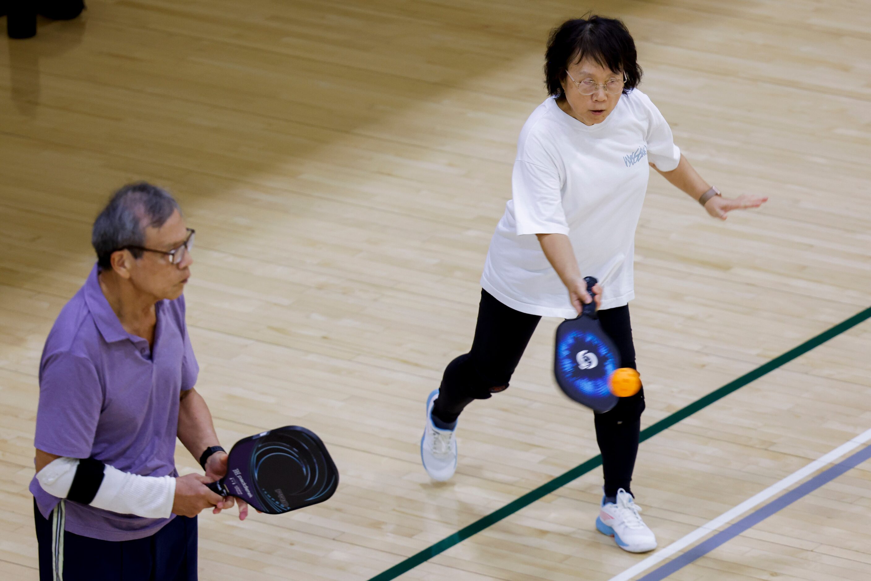 Yawen Tiegerman (right) of Frisco hits during a pickle ball game on Friday, May 26, 2023 at...