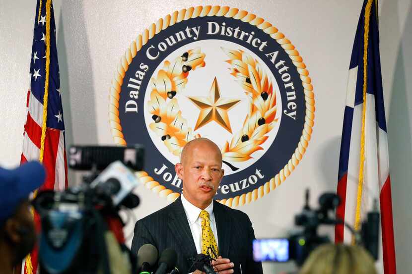 District Attorney John Creuzot held a news conference at the Frank Crowley Courts Building...