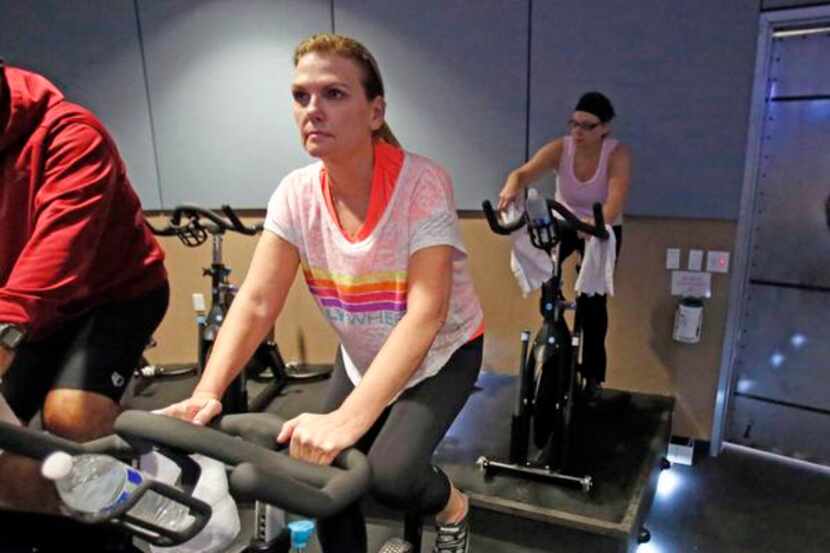 
Linda Bezner,  55, works out in a spin class at Flywheel in Plano. She also runs and walks...