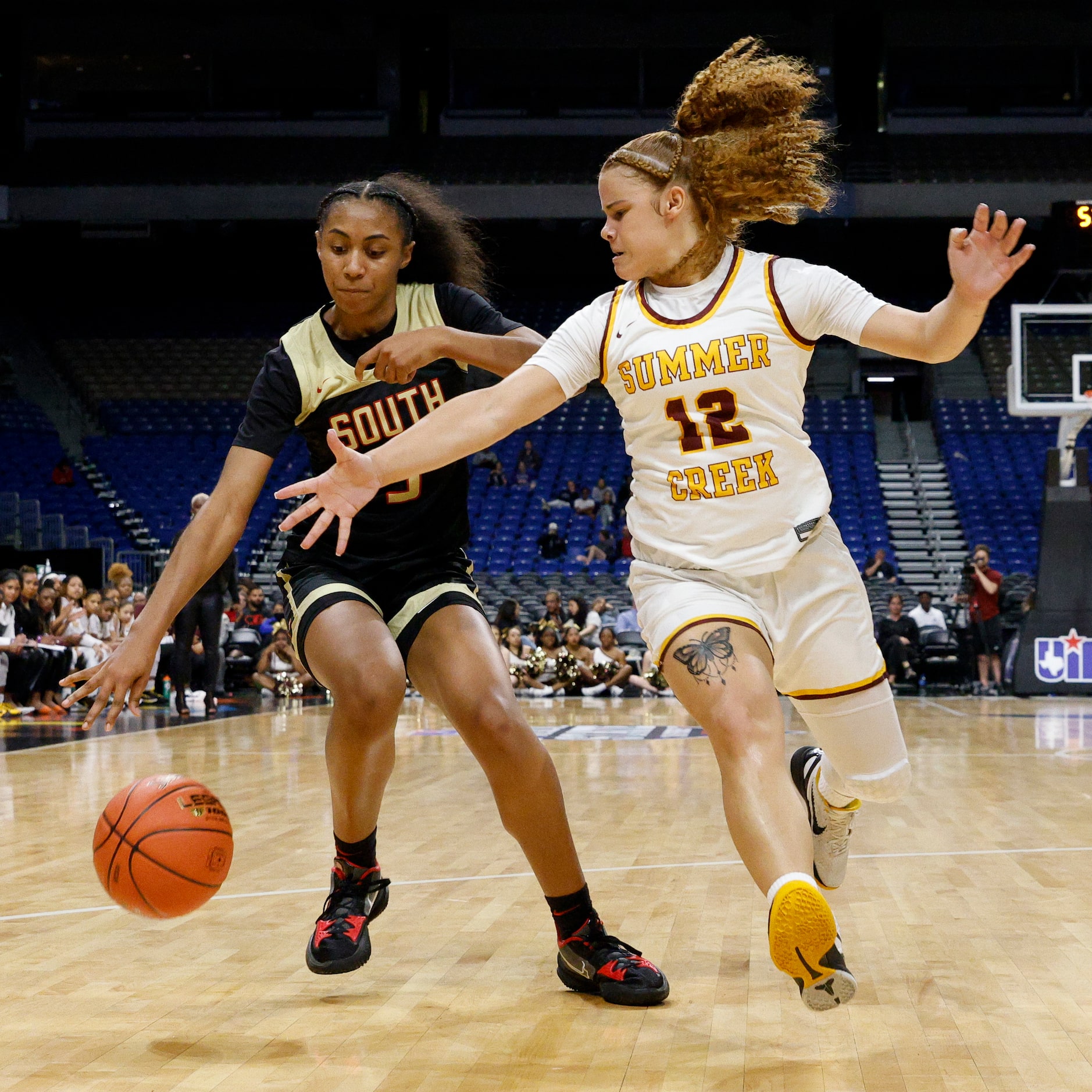 Humble Summer Creek guard Viveon Pierre (12) defends a driving South Grand Prairie guard...