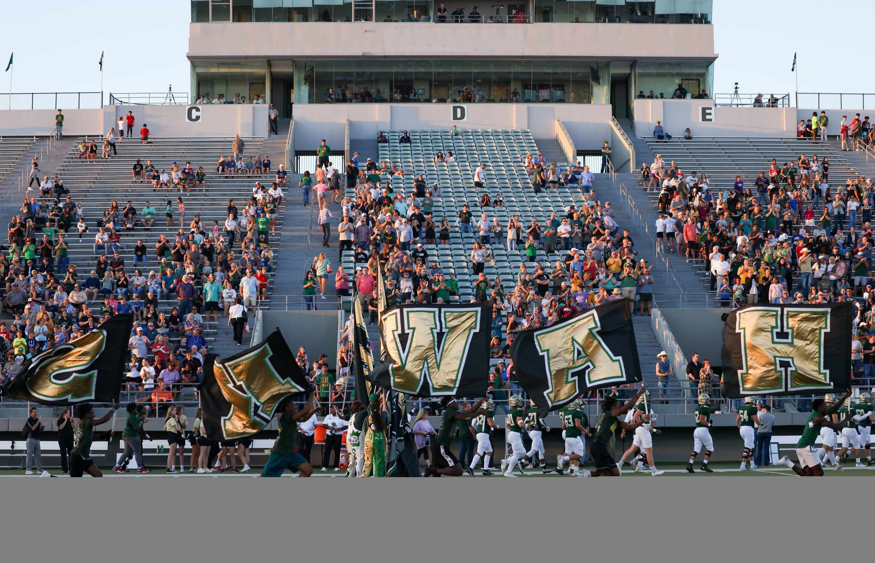 The Birdville Hawks enter the field before a game against Mansfield Timberview at the...