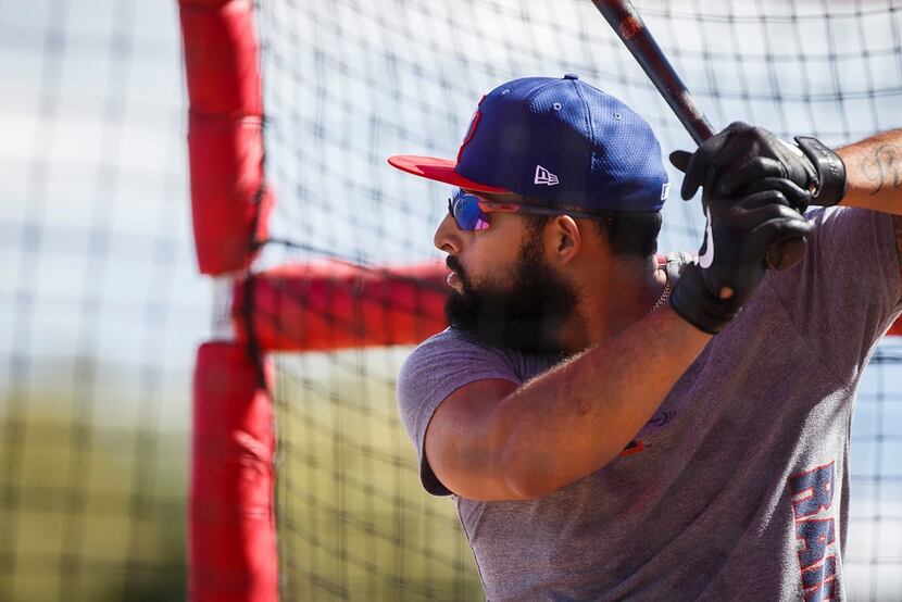Texas Rangers infielder Rougned Odor takes batting practice during a spring training workout...