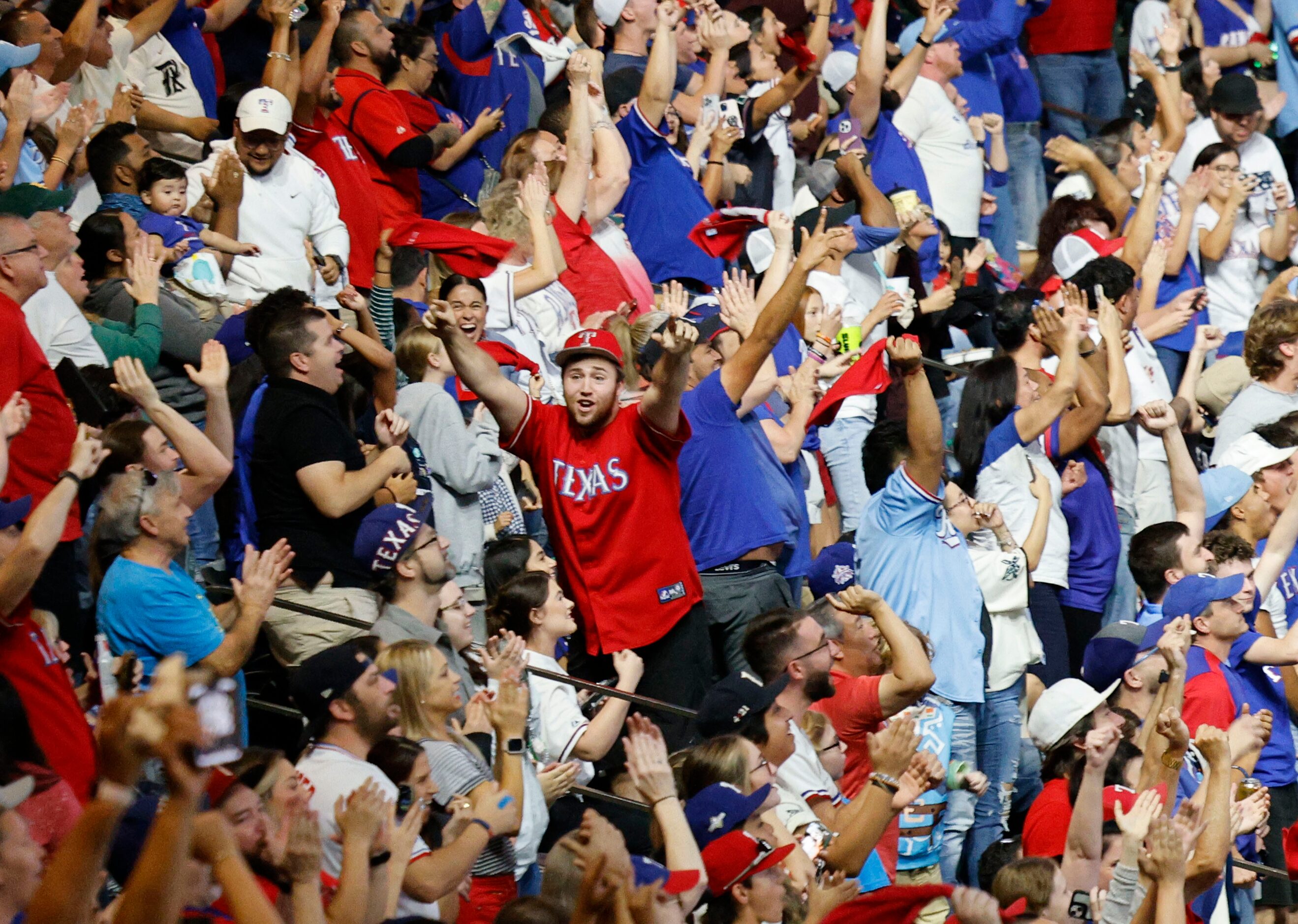 Texas Rangers fans react during a Game 7 watch party of the baseball American League...