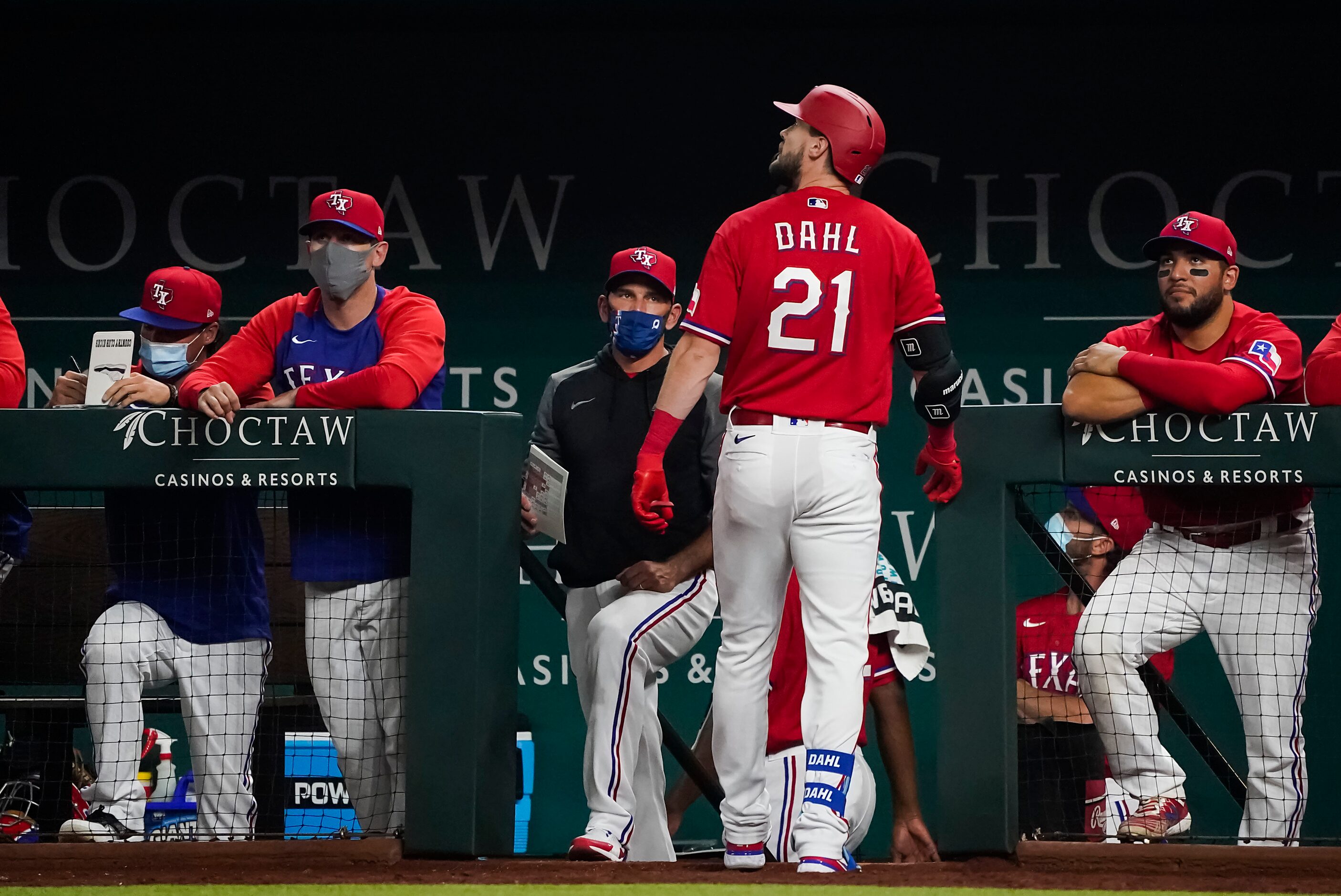 Texas Rangers pinch hitter David Dahl looks back to see the reply after he lined out to...