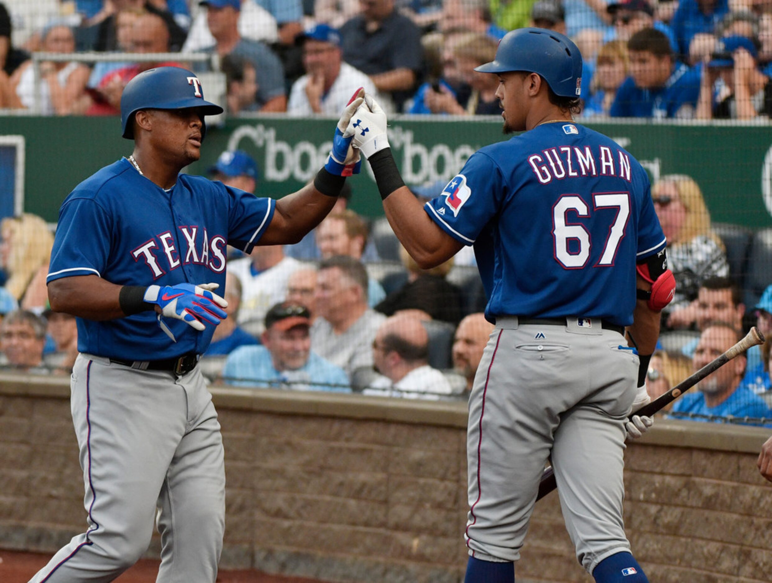 KANSAS CITY, MO - JUNE 19: Adrian Beltre #29 is congratulated by Ronald Guzman #67 of the...