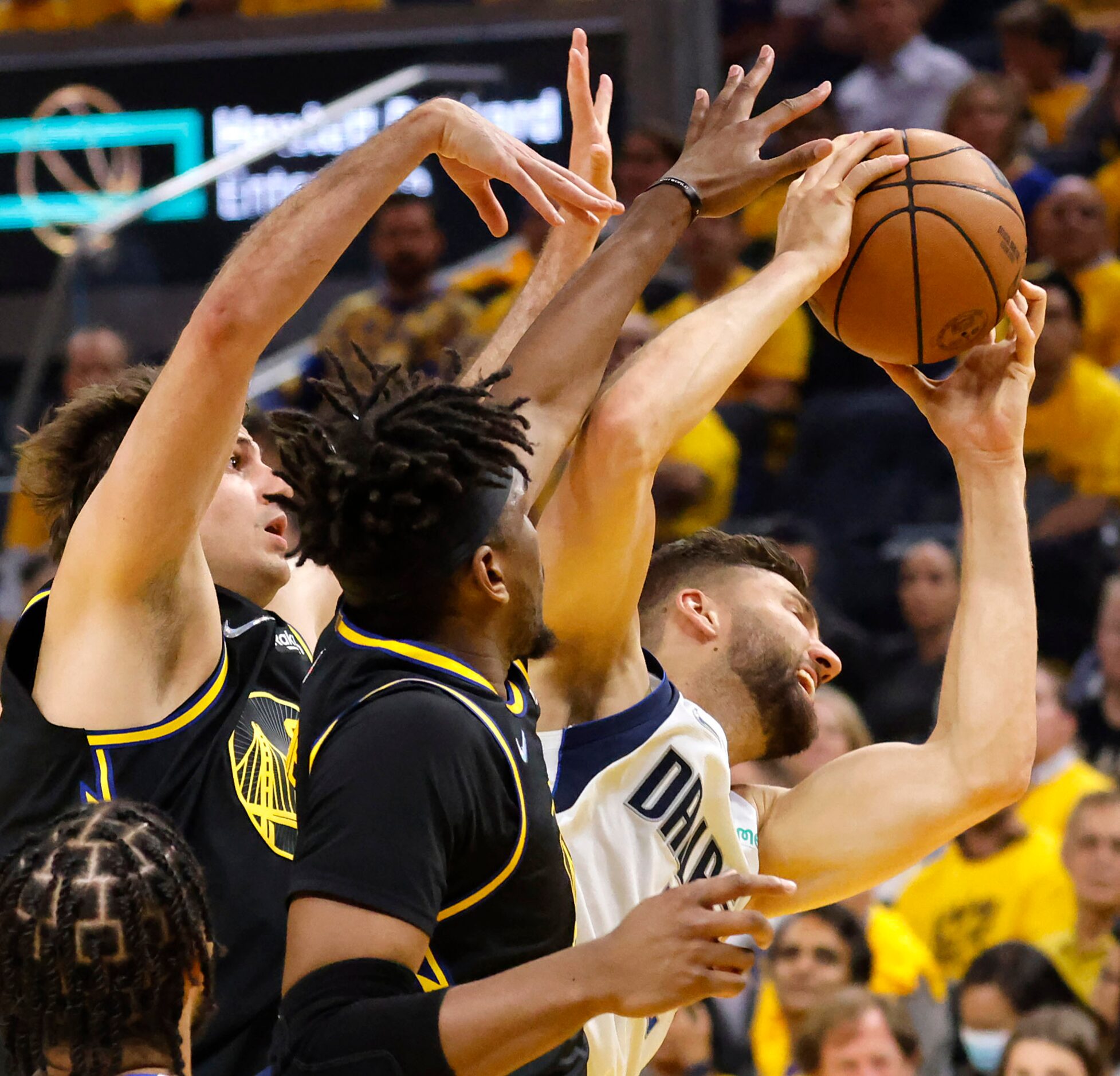 Dallas Mavericks forward Maxi Kleber (42) rebounds the ball against Golden State Warriors...