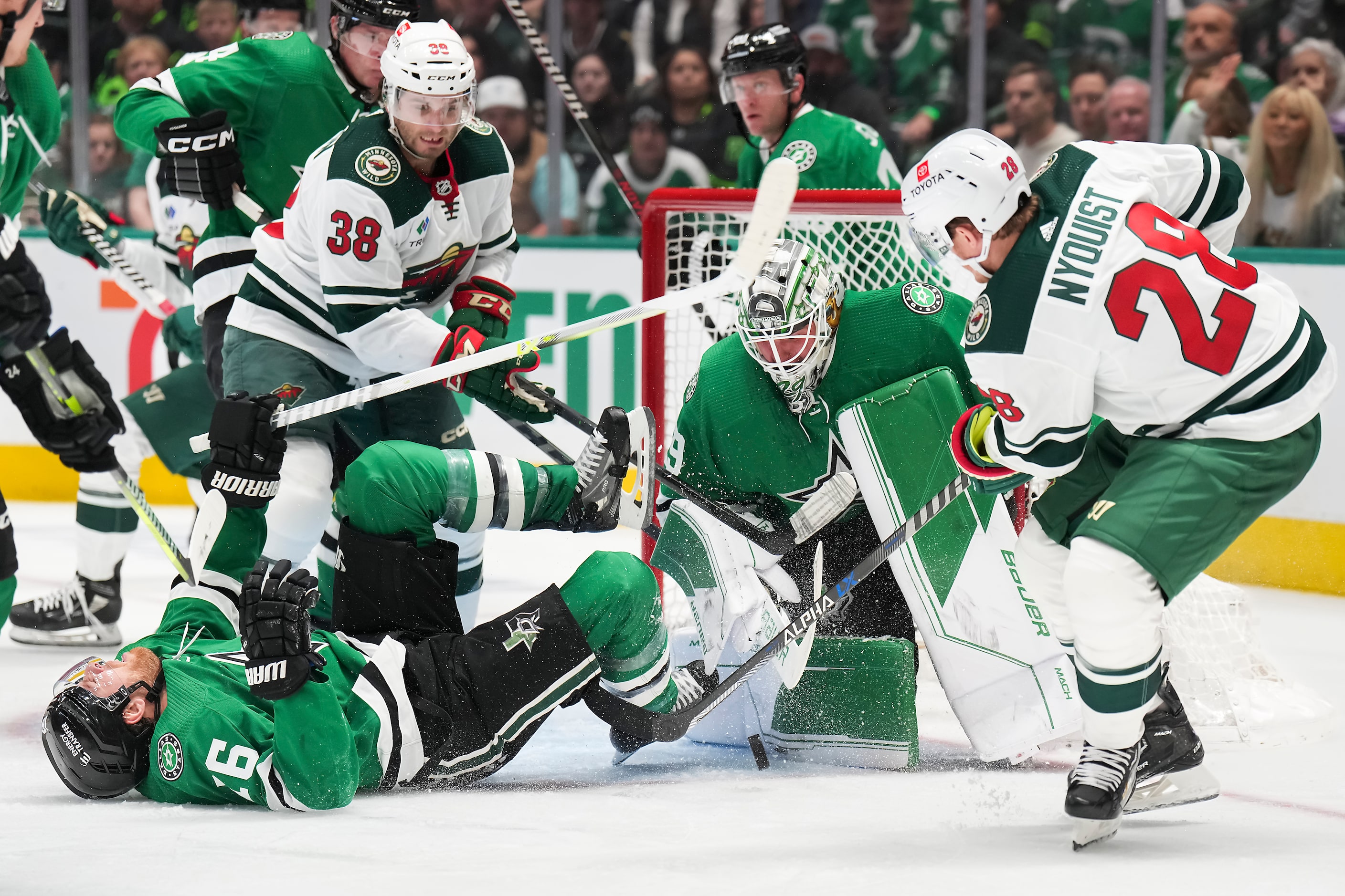 Dallas Stars goaltender Jake Oettinger (29) makes a save against Minnesota Wild center...