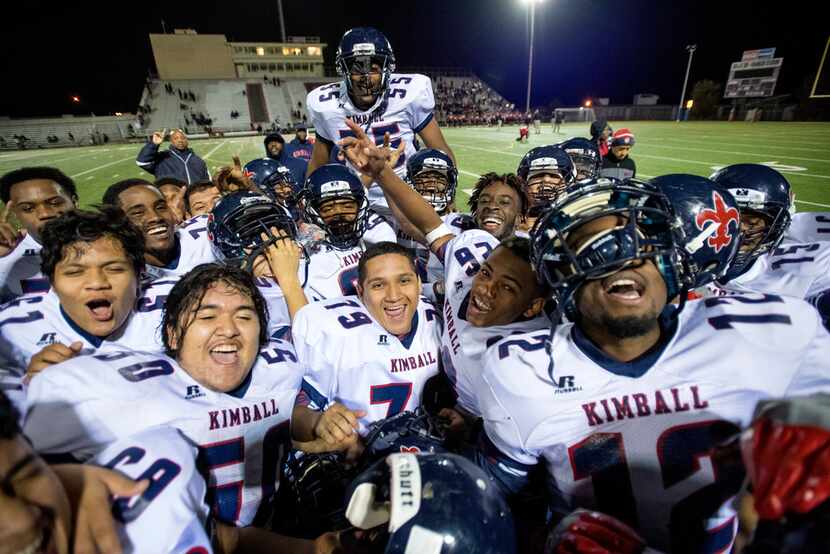 The Kimball Knights celebrate after defeating Hillcrest 50-14 and securing a playoff berth...
