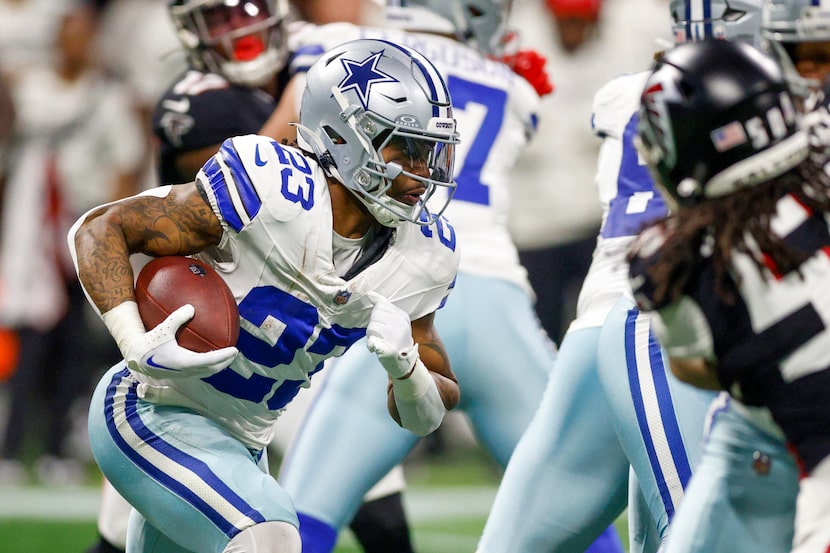 Dallas Cowboys running back Rico Dowdle (23) runs the ball through the line of scrimmage...