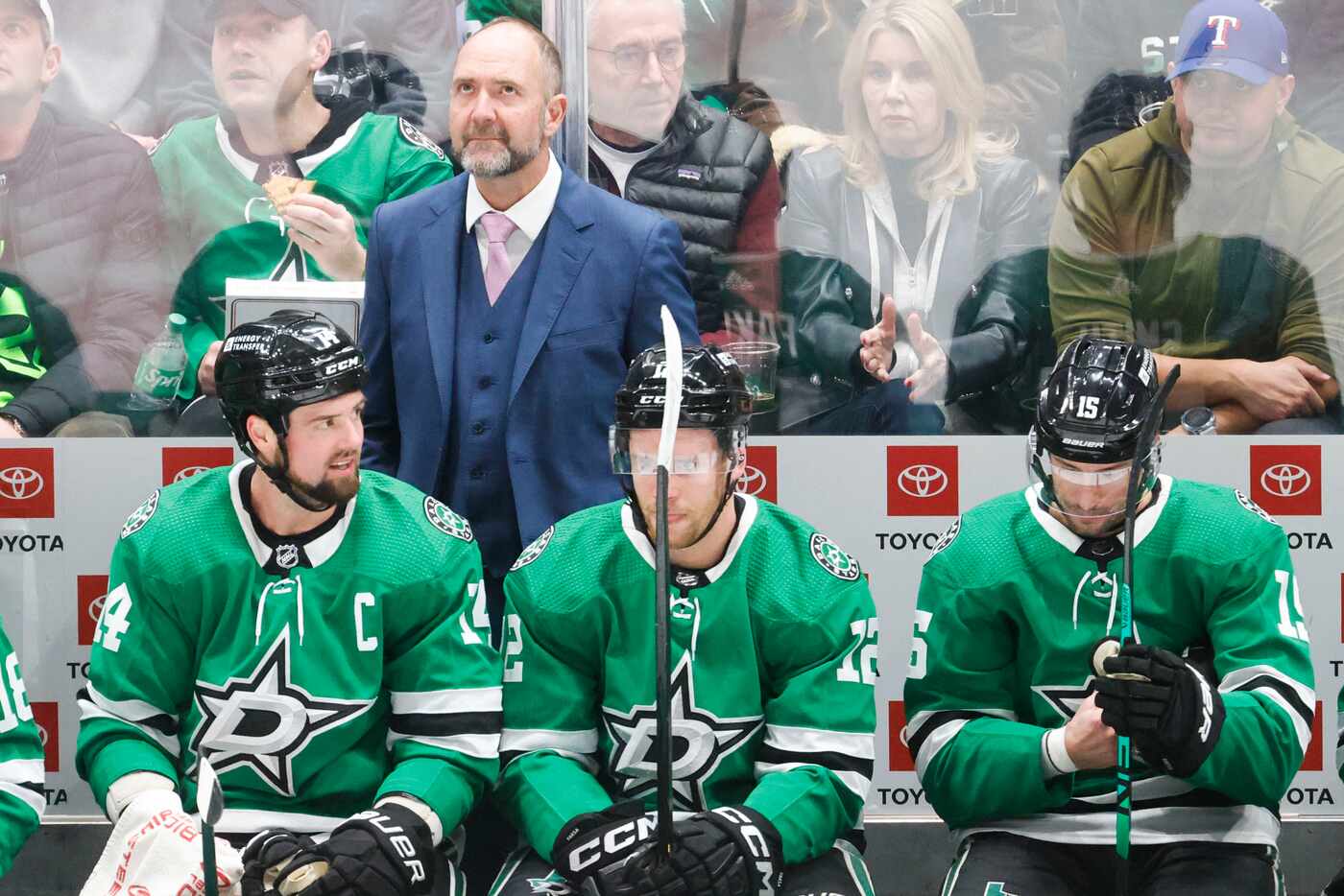 Dallas Stars coach Peter DeBoer watches the score board during the first period of an NHL...