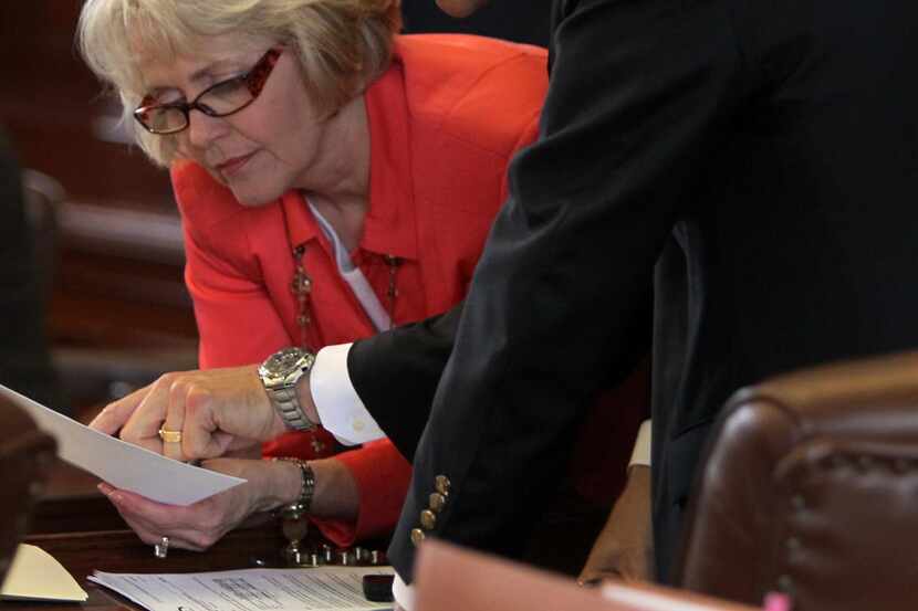 
State Rep. Cindy Burkett (left) of Sunnyvale discusses legislation with a colleague....