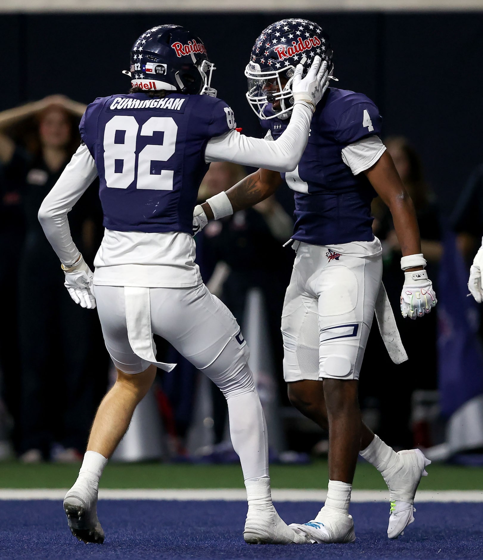 Denton Ryan running back Tre'Vaughn Reynolds (4) and wide receiver Connelly Cunningham (82)...