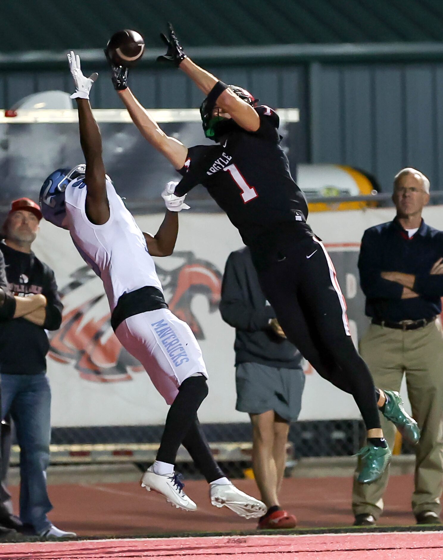 Argyle wide receiver Will Krzysiak (1) goes up high for the ball against Frisco Emerson...