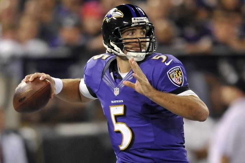 Baltimore Ravens quarterback Joe Flacco throws to a receiver in the second half of an NFL...