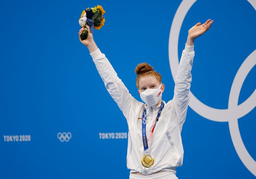 USA’s Lydia Jacoby celebrates after receiving her gold medal during the medal ceremony for...