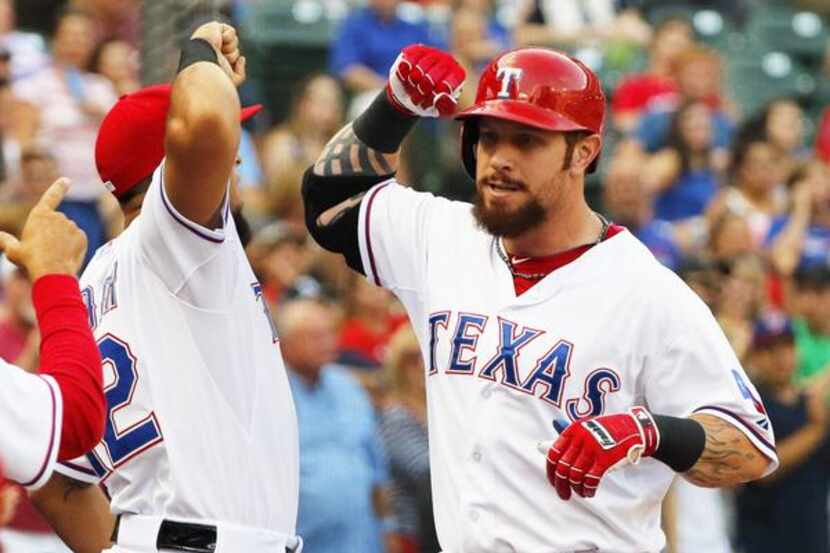 Texas Rangers left fielder Josh Hamilton (32) celebrates a 3-run home-run with Texas Rangers...
