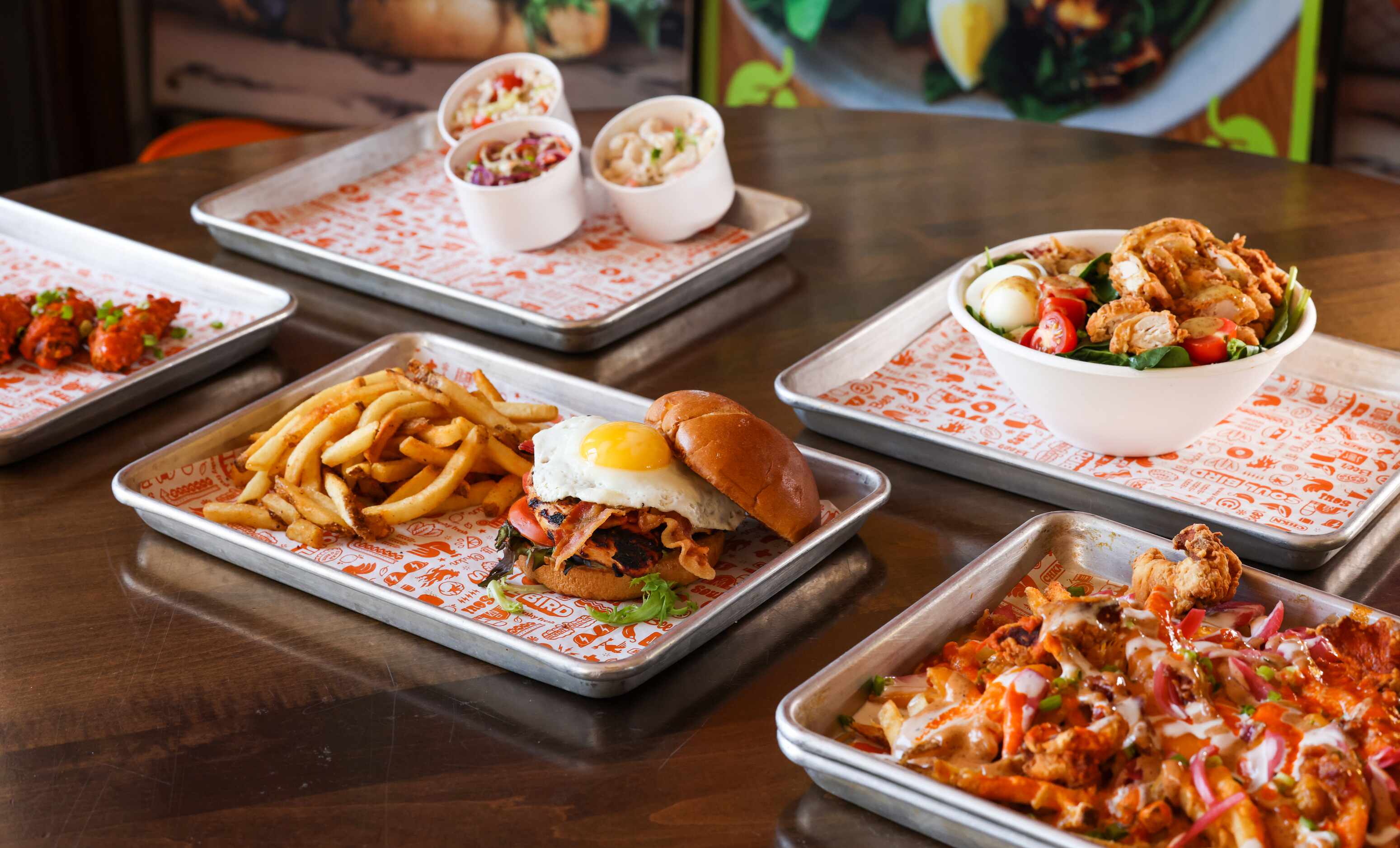 Soul Bird menu options including wings, The Shack burger (front center), Soul Fries (front...